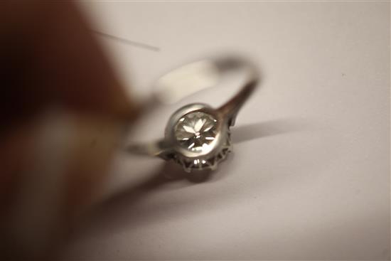 A modern platinum and solitaire diamond ring, size Q.